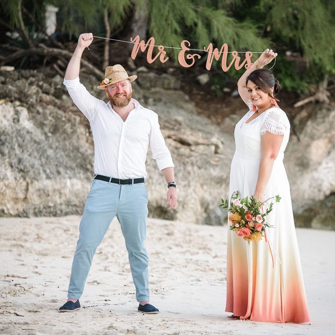A couple celebrating their wedding on Enterprise Beach in Barbados.